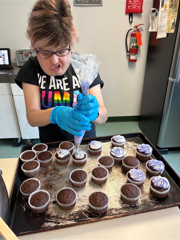 A member baking cupcakes