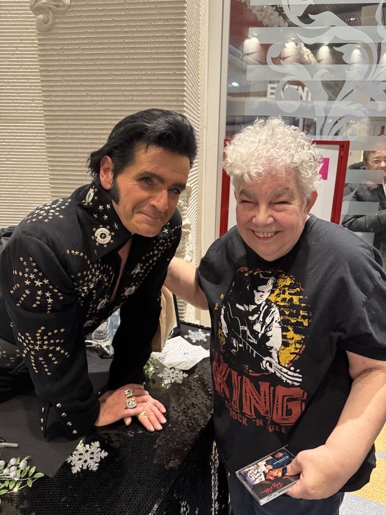 Two people smiling at the camera