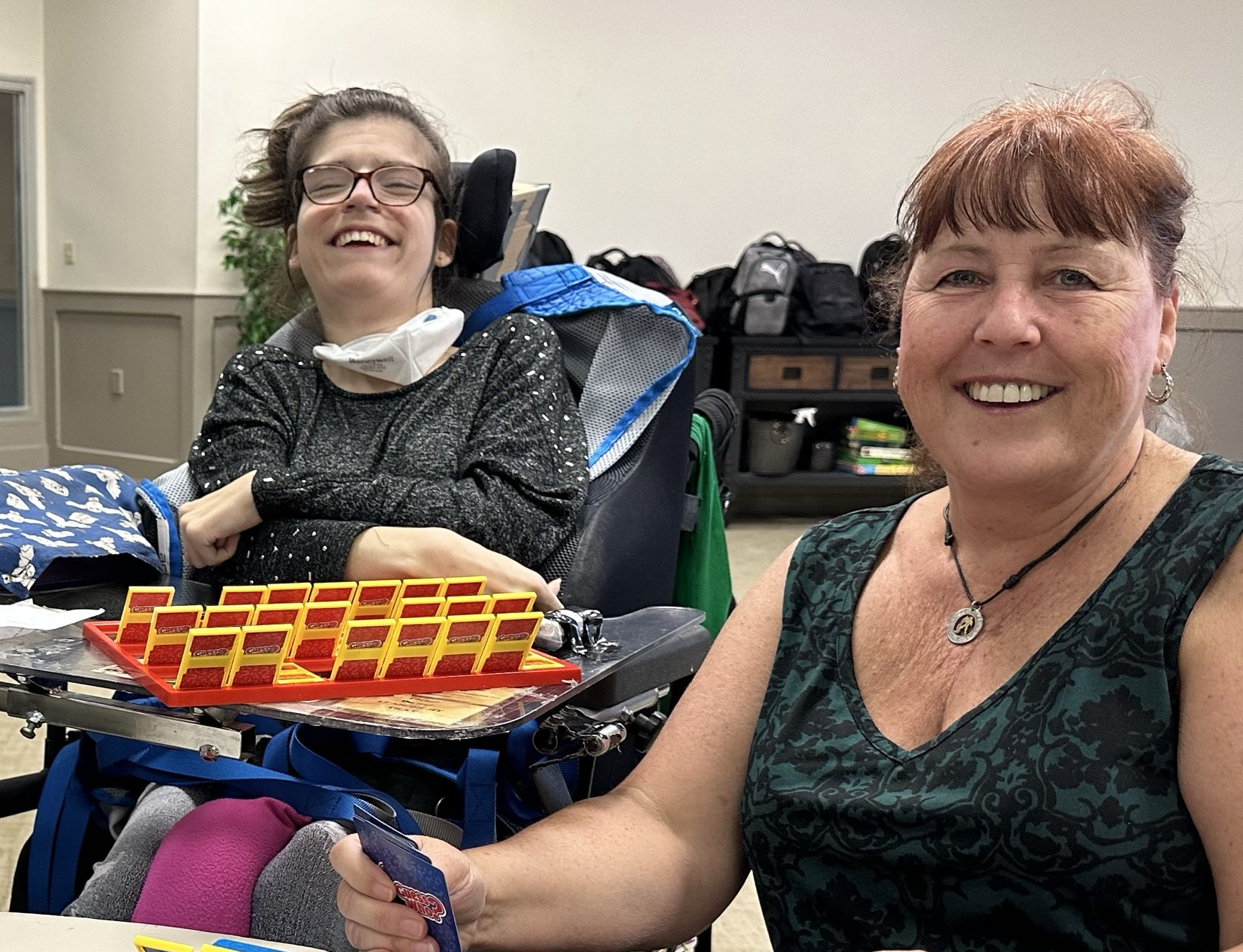 Two people smiling at the camera